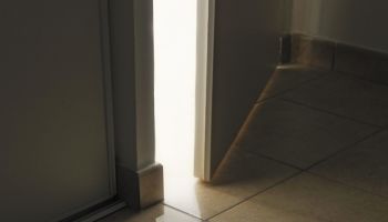 Light rays on Handgun from doorway left ajar