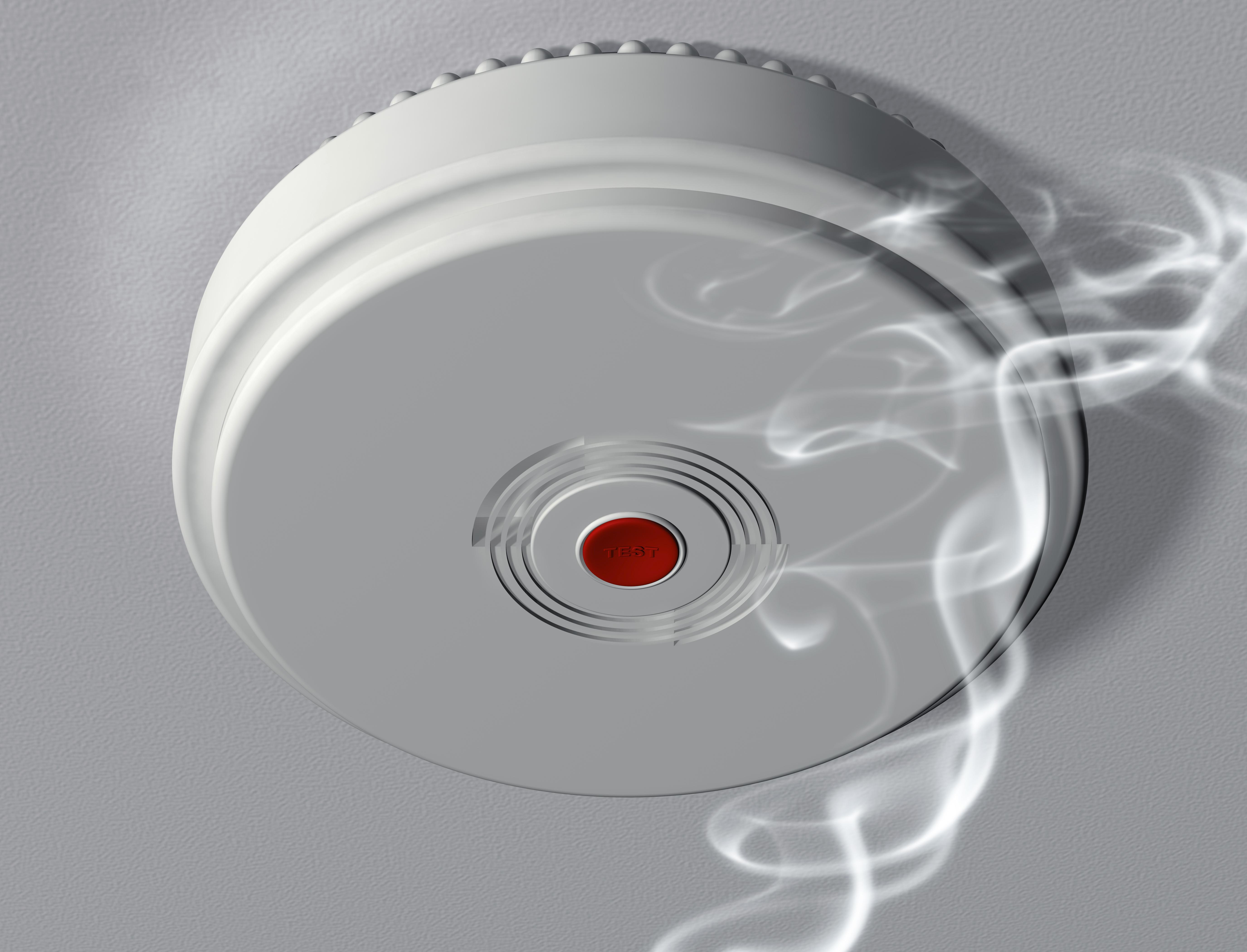 Illustration of a smoke alarm warning of a fire