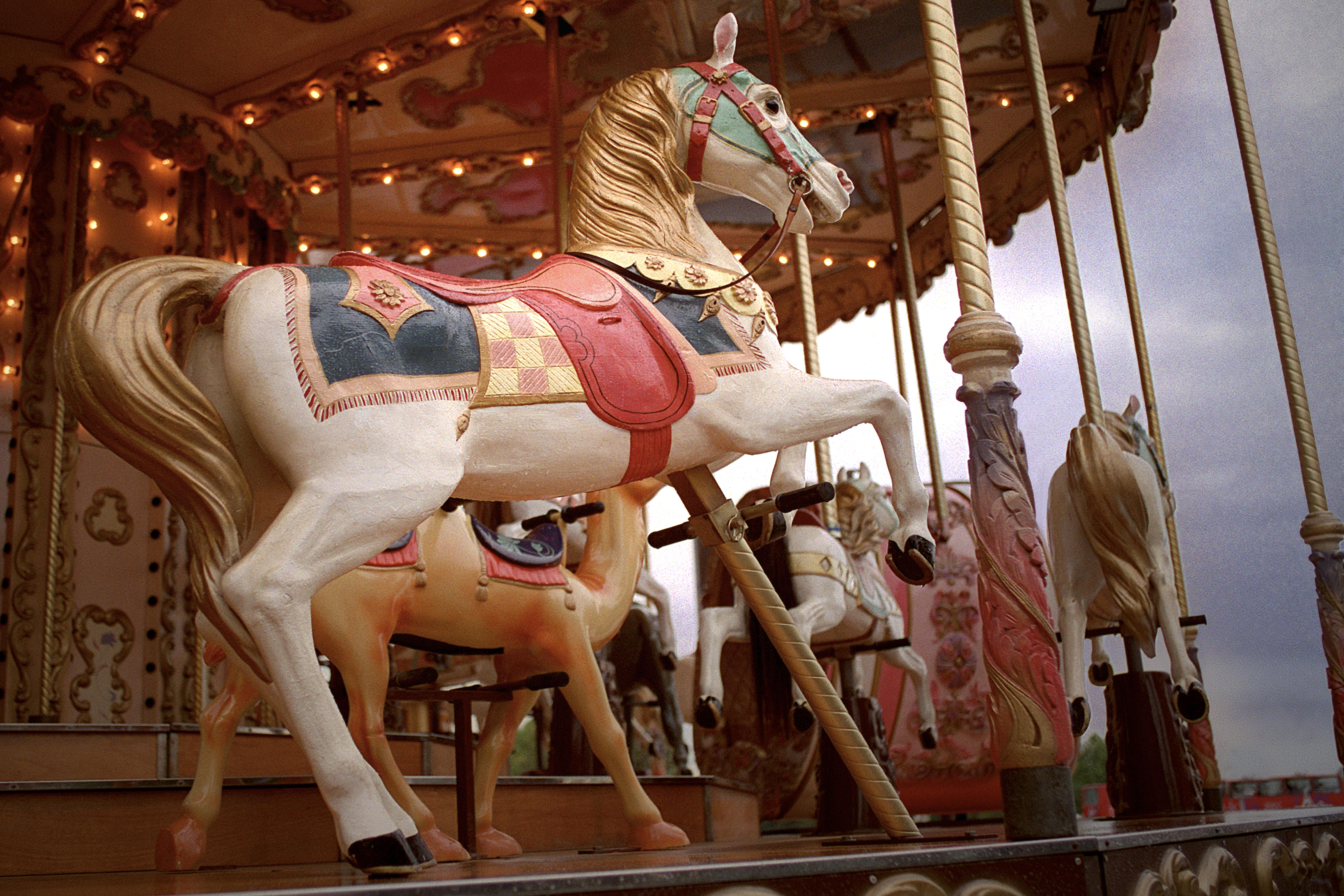 Low angle of a sculpted horse on a carousel in Paris, France