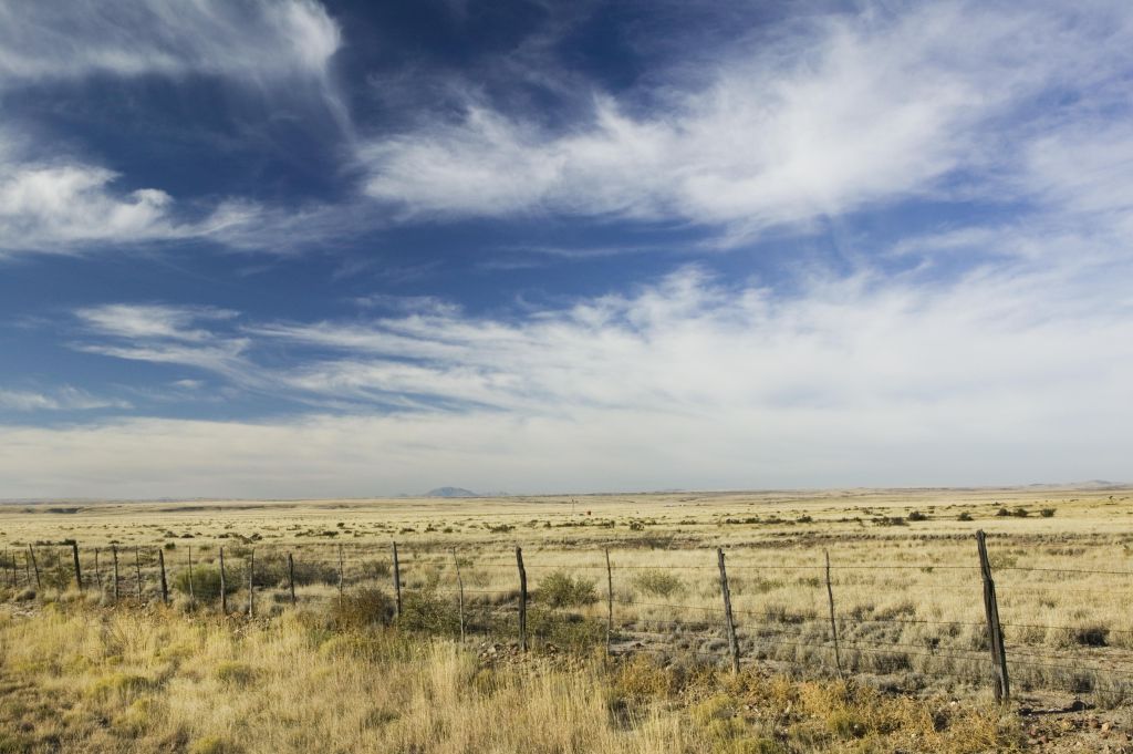 USA, Texas, Marfa, fence across ranch land