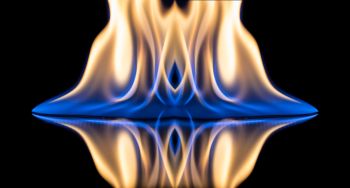 Flames of orange and blue with reflections on a black background color