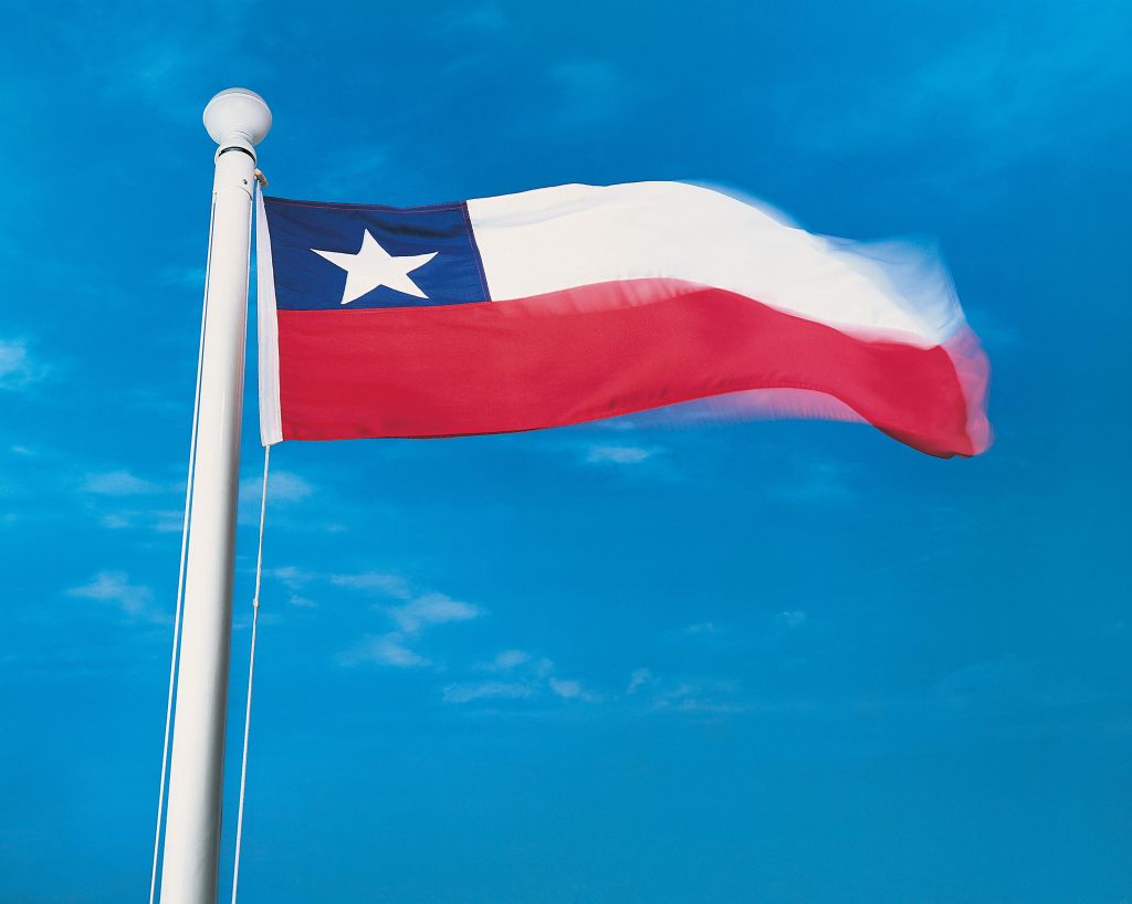 Flag of Chile on flagpole waving in the wind