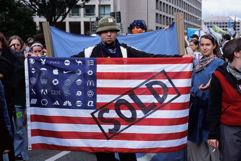 Protester Displays a Modified American Flag