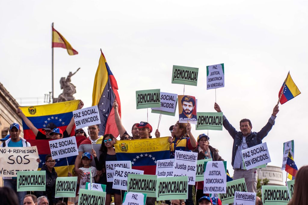 Venezuelans protesting the current situation of their...
