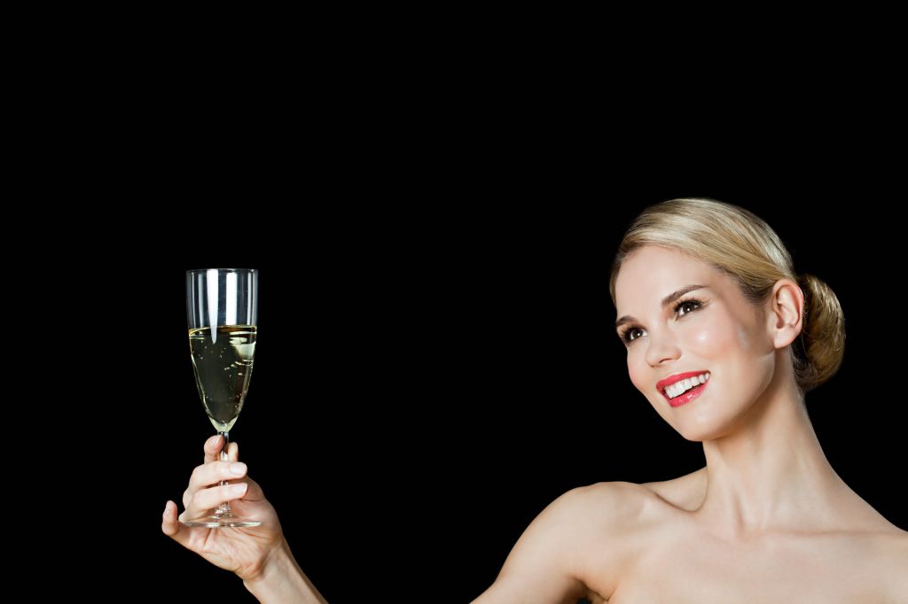 Young blonde woman with champagne glass