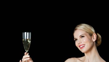 Young blonde woman with champagne glass