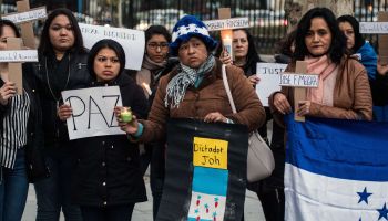 The Honduran community in Madrid marching against President...