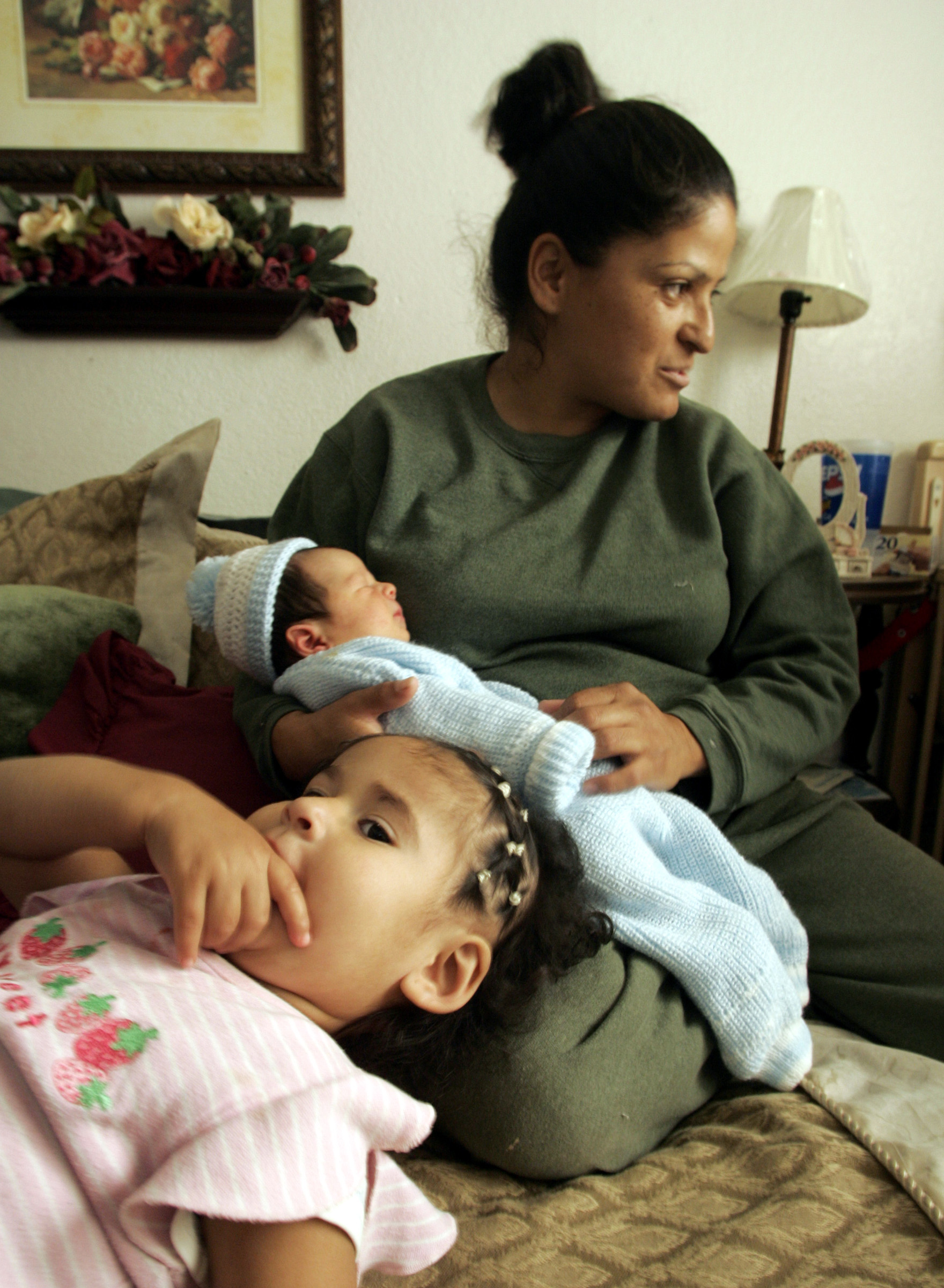 (Phoenix,AZ)Virgilia Garcia gave birth to her daughter Nareda,1, (foreground) and her son Brando (i