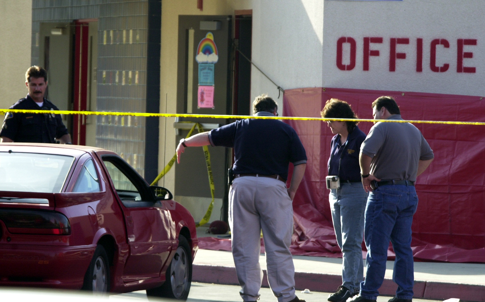 Investigators go over the scene of a fatal accident at Centralia Elementary school where two girls d