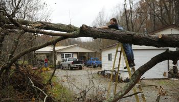 Clearing tornado damage in a driveway