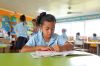 Young Pacific Islander girl study in school in Rarotonga Cook Islands