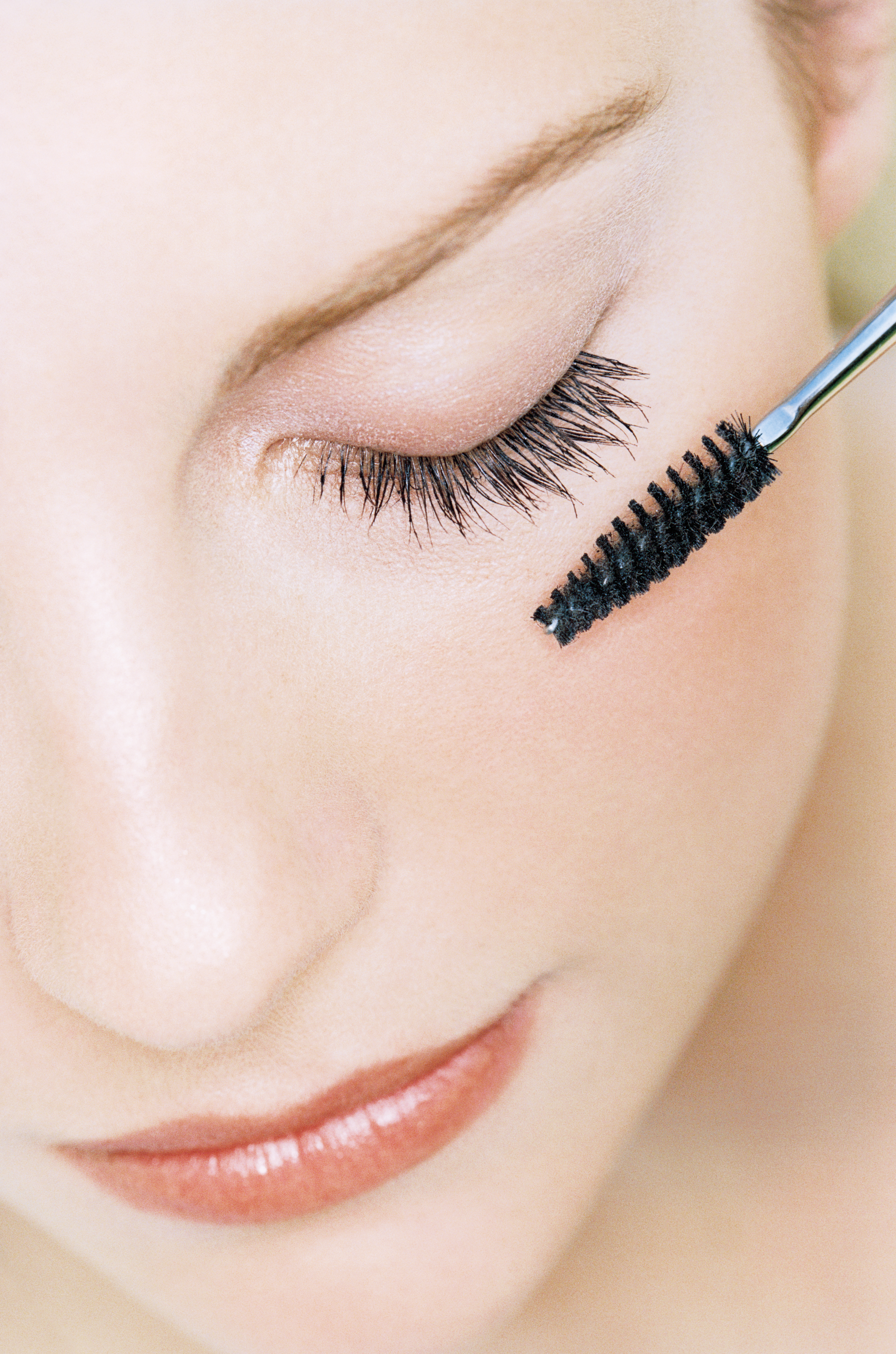 Young Woman Applying Mascara