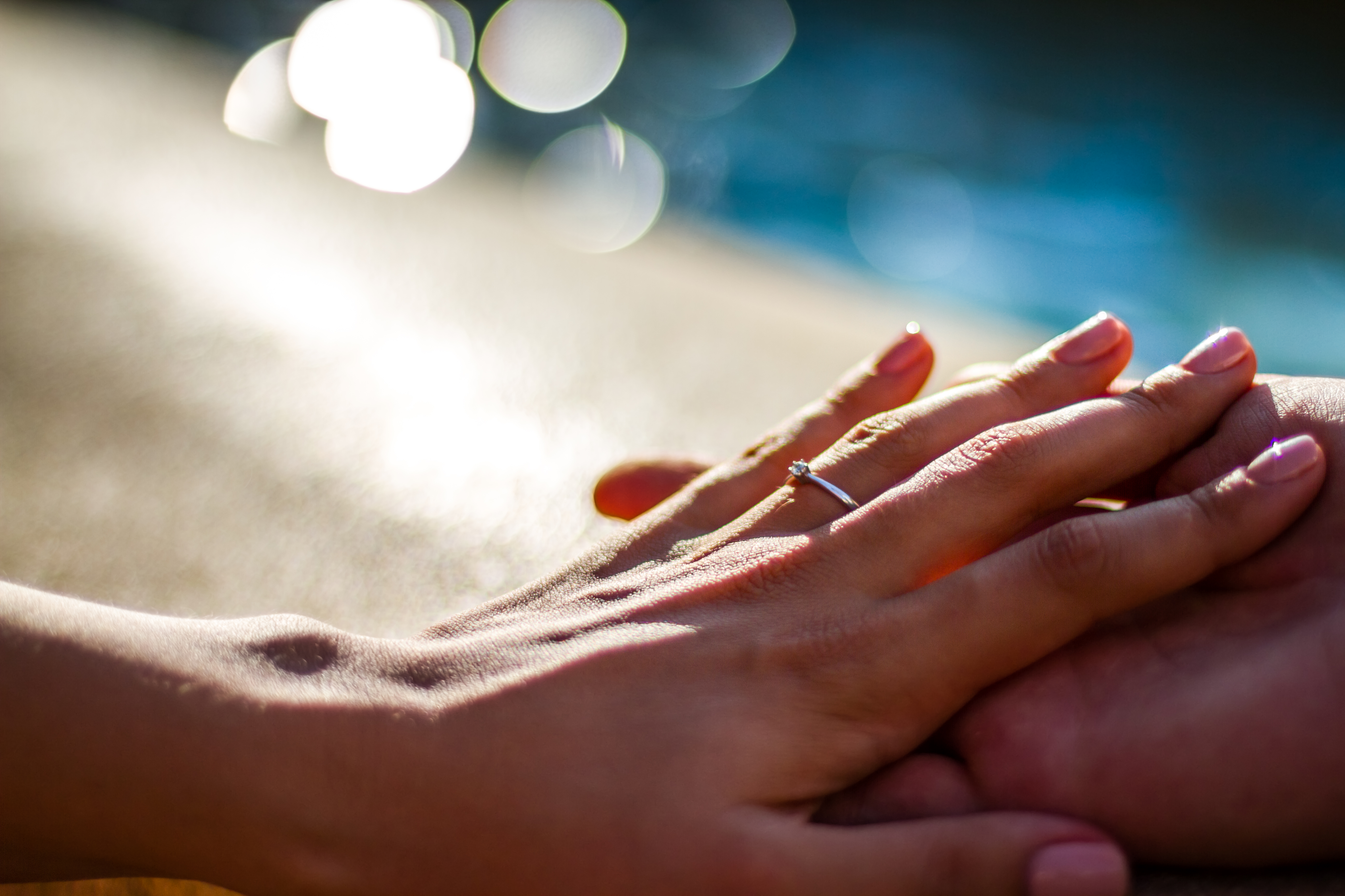 Holding Hands with wedding rings, wedding and engagement background