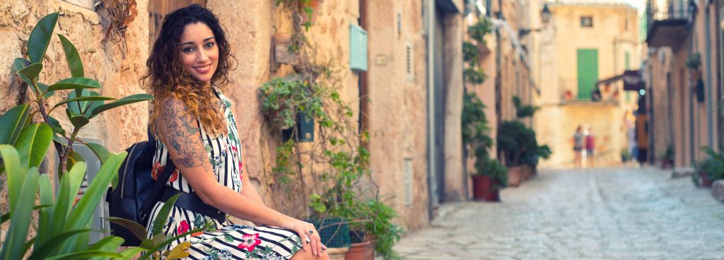 Woman sitting on the street of the old town