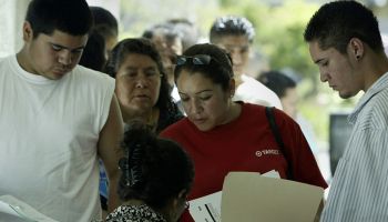 Immigrants wait in line to apply for a matricula card. The matricula is a Mexican identification ca