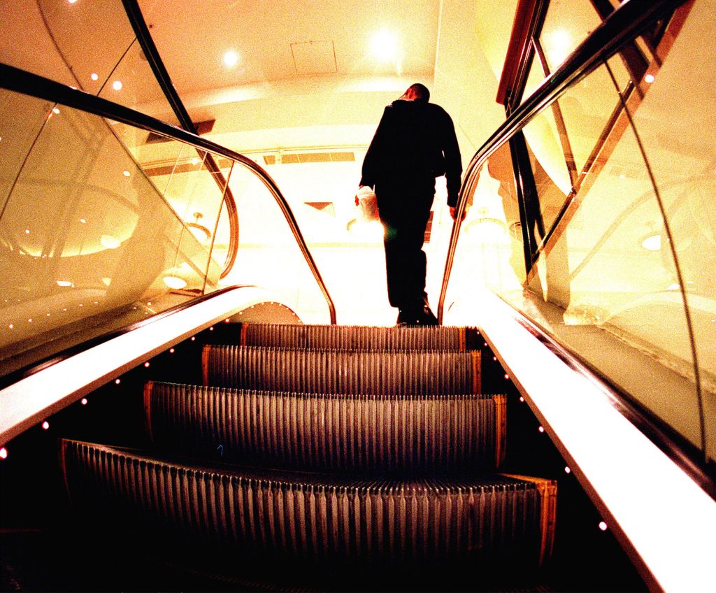 A man reaches the top of the escalator, 20 November 2004. NCH Picture by RYAN O