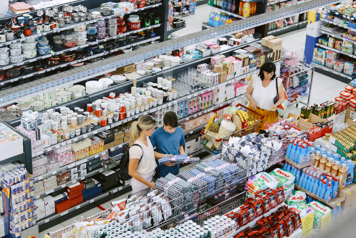 Overhead image of people buying in the large supermarket