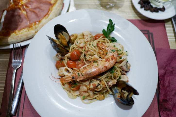 Up view plate frutti di mare seafood gourmet and vegetable healthy on crockery