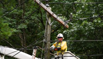 A Crew Works on Power Lines Downed by Tropical Storm Isaias on Long Island in 2020