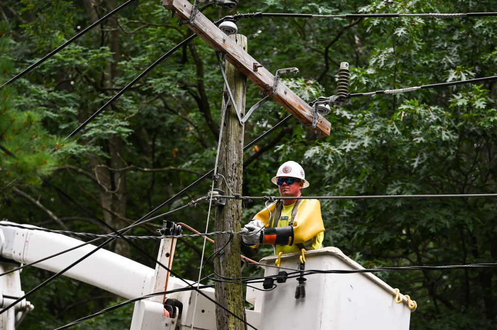 A Crew Works on Power Lines Downed by Tropical Storm Isaias on Long Island in 2020