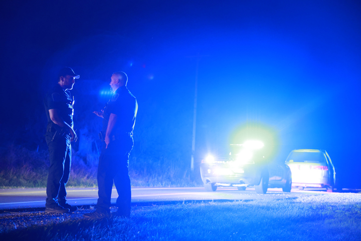 Police work at the scene of a traffic stop