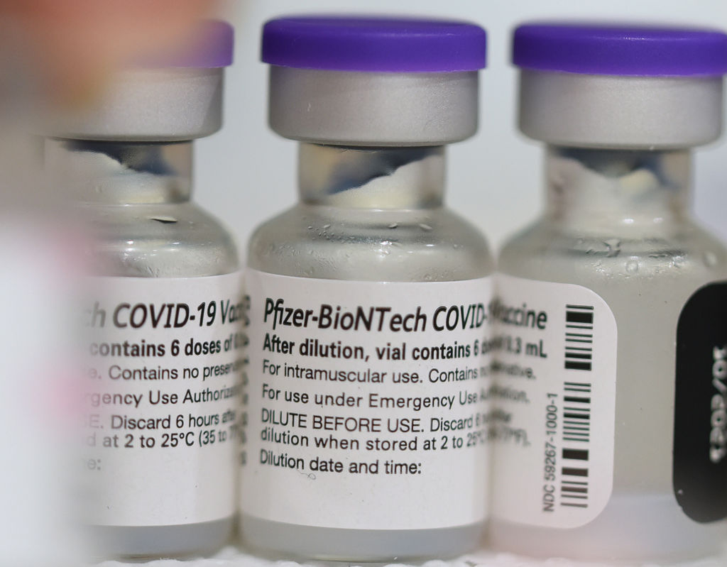 Vials of the Pfizer COVID-19 vaccine are seen at a...