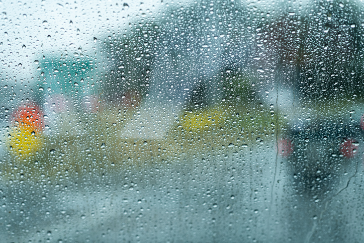 Rain drops on a bus window driving through Boston