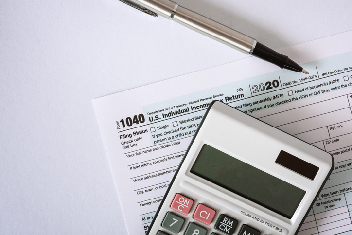 Close Up of Tax Form 1040 and Calculator