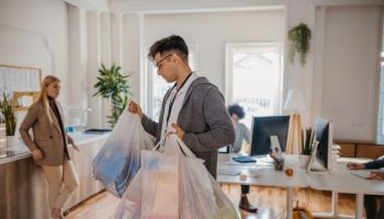 Man bringing groceries for colleagues