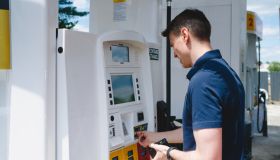 Man Uses Credit Card to Purchase Gas at Pump