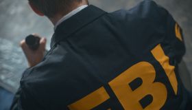FBI agent's uniform with inscription on a man's back