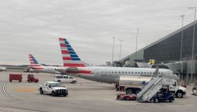 American Airlines airplanes being loaded with baggage before taking off, West Palm Beach Gardens Airport, Florida