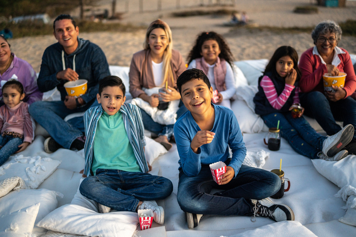 Group of people watching a movie outdoors