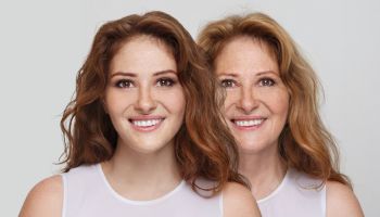 Young beautiful redhead woman and smiling senior lady portrait
