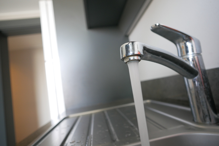 water pouring from a faucet tap slow motion