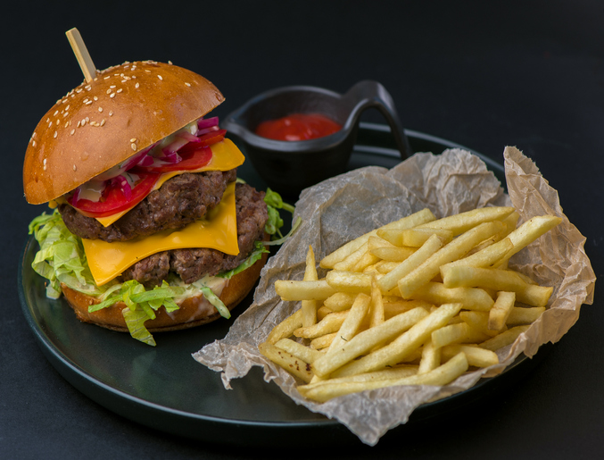Hamburger, french fries, cola drink. Takeaway food. Fast food.