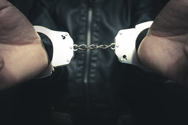 prisoner concept,Handcuffed hand of prisoner in prison, Male prisoners were severely strained in the dark prison, violence