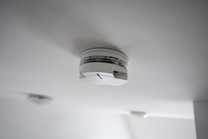 Smoke detector on a ceiling of a modern house