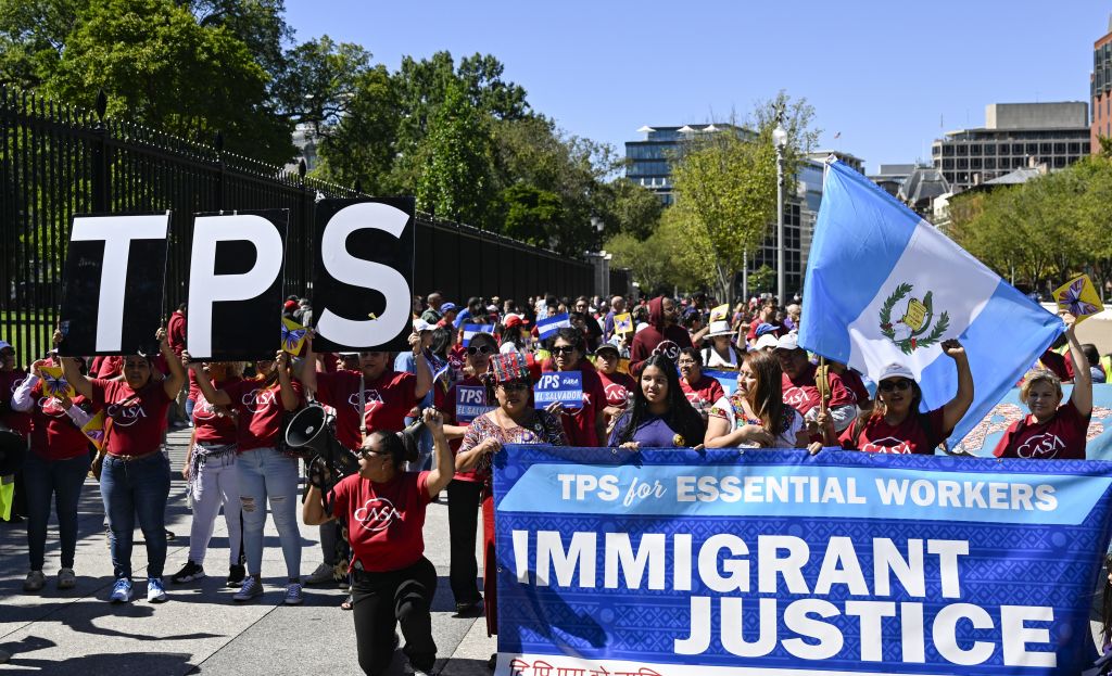 Protesters march in solidarity with immigrant workers in Washington DC