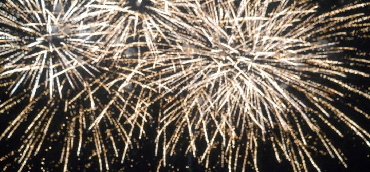 Blurred background Golden Firework celebrate anniversary happy new year 2025, 4th of july holiday festival. Blurry gold firework night time celebrate national holiday. Countdown to new year 2025 festival