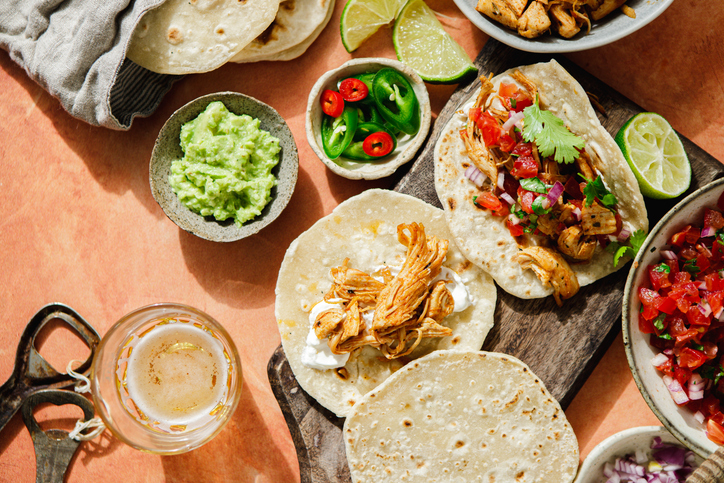 High angle view of variety of Mexican tacos served on table