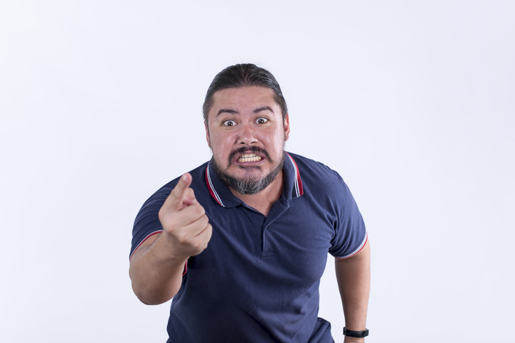 A furious and irate man complains excessively and hurls insults. Customer complaint concept.