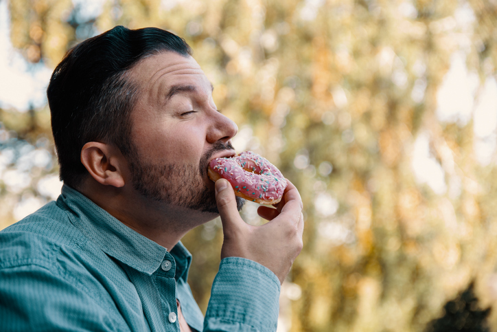 Enjoying eating donut