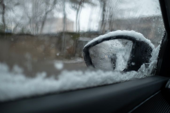 Snow on the city .Dangerous driving