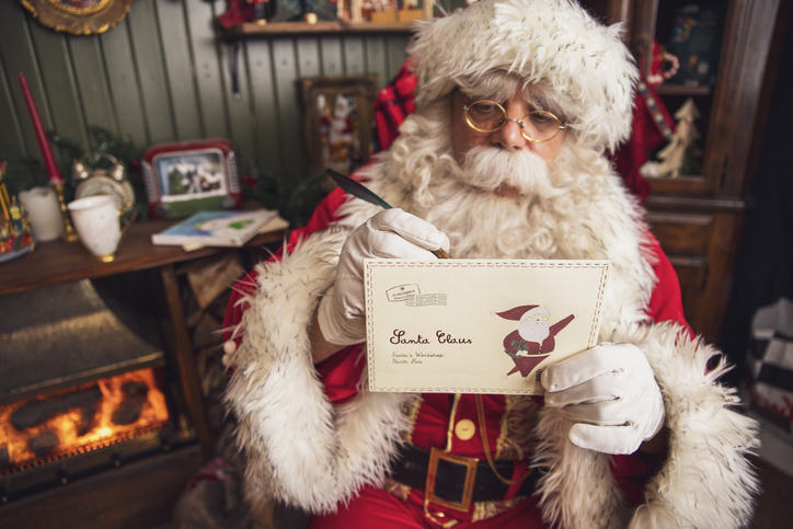 Santa Claus writing a greeting card