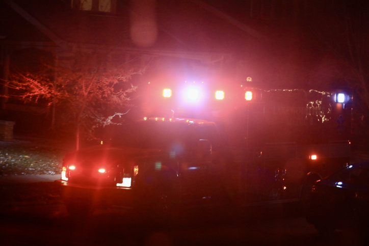 Ambulance with flashing lights at a car accident