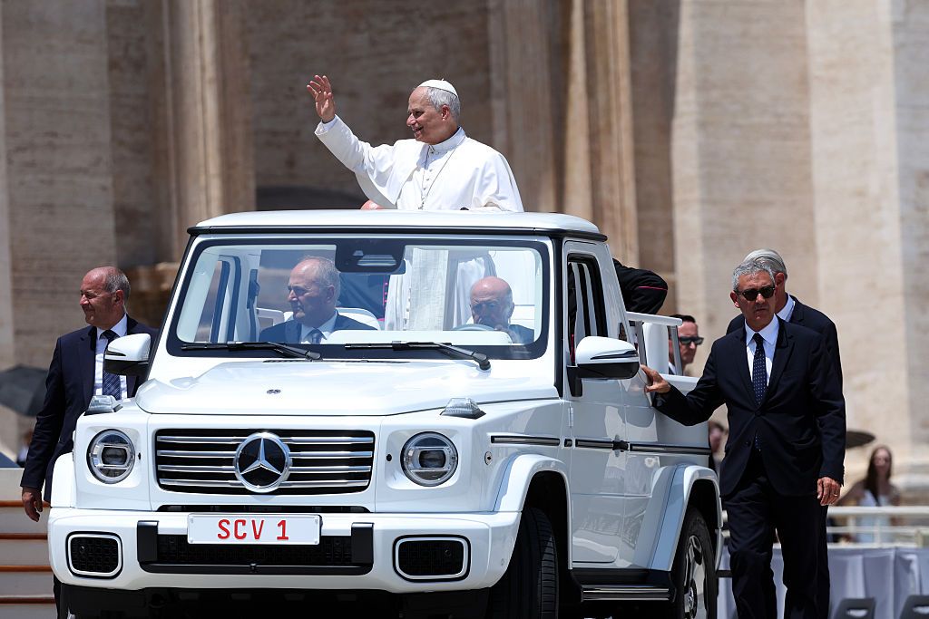 The pontiff seen waving to the faithful as he leaves the