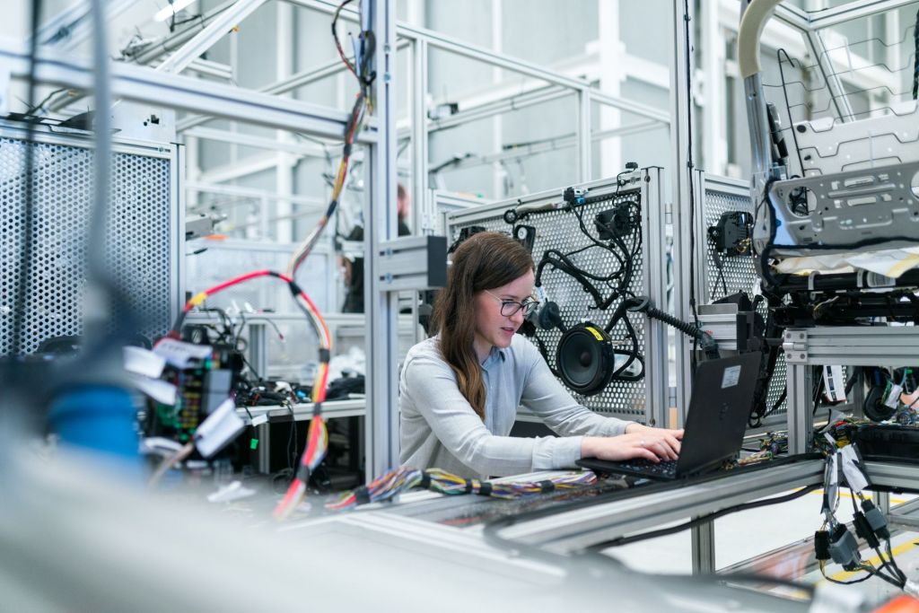 photo of female engineer working on her workspace