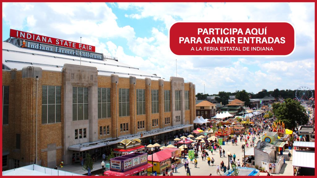 Indiana State Fair, with crowds and rides visible at the fairgrounds. Sign reads "PARTICIPA AQUÍ PARA GANAR ENTRADAS A LA FERIA ESTATAL DE INDIANA".