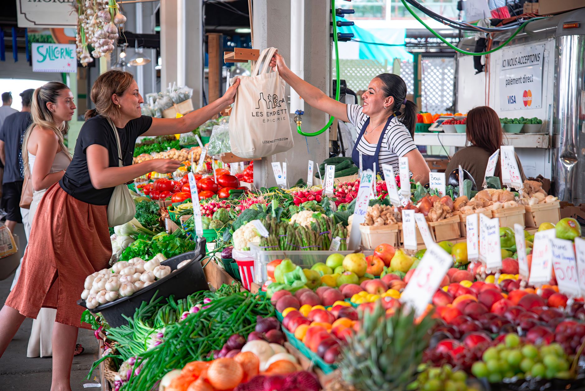 a woman buying fresh food at the market
